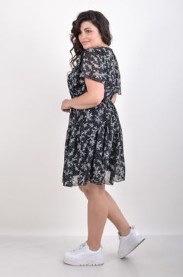 A everyday summer dress with a chiffon. The flower is black.495278311 495278311 photo